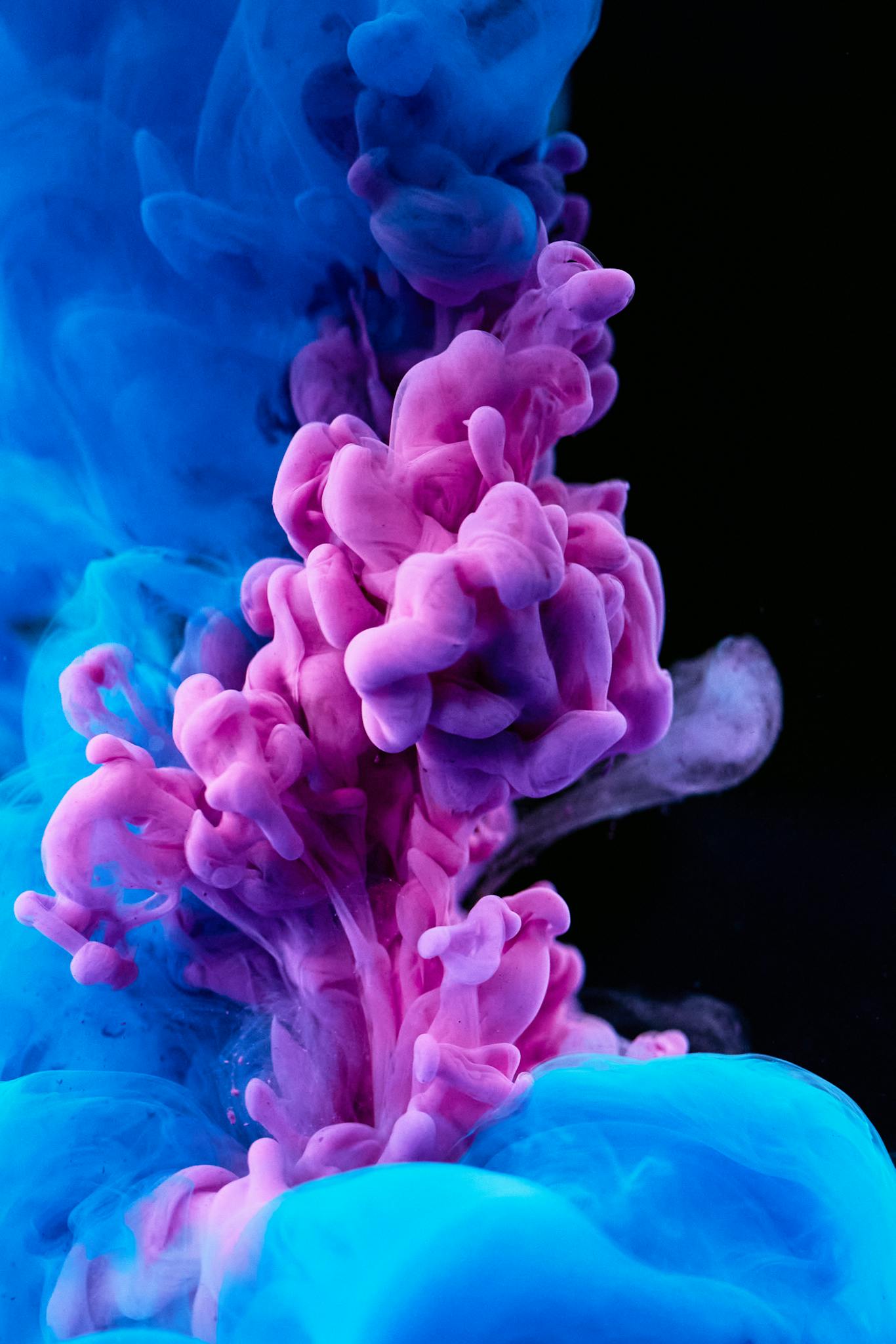 Albums 5 Stunning capture of colorful ink diffusing in water, showcasing vibrant blues and purples.