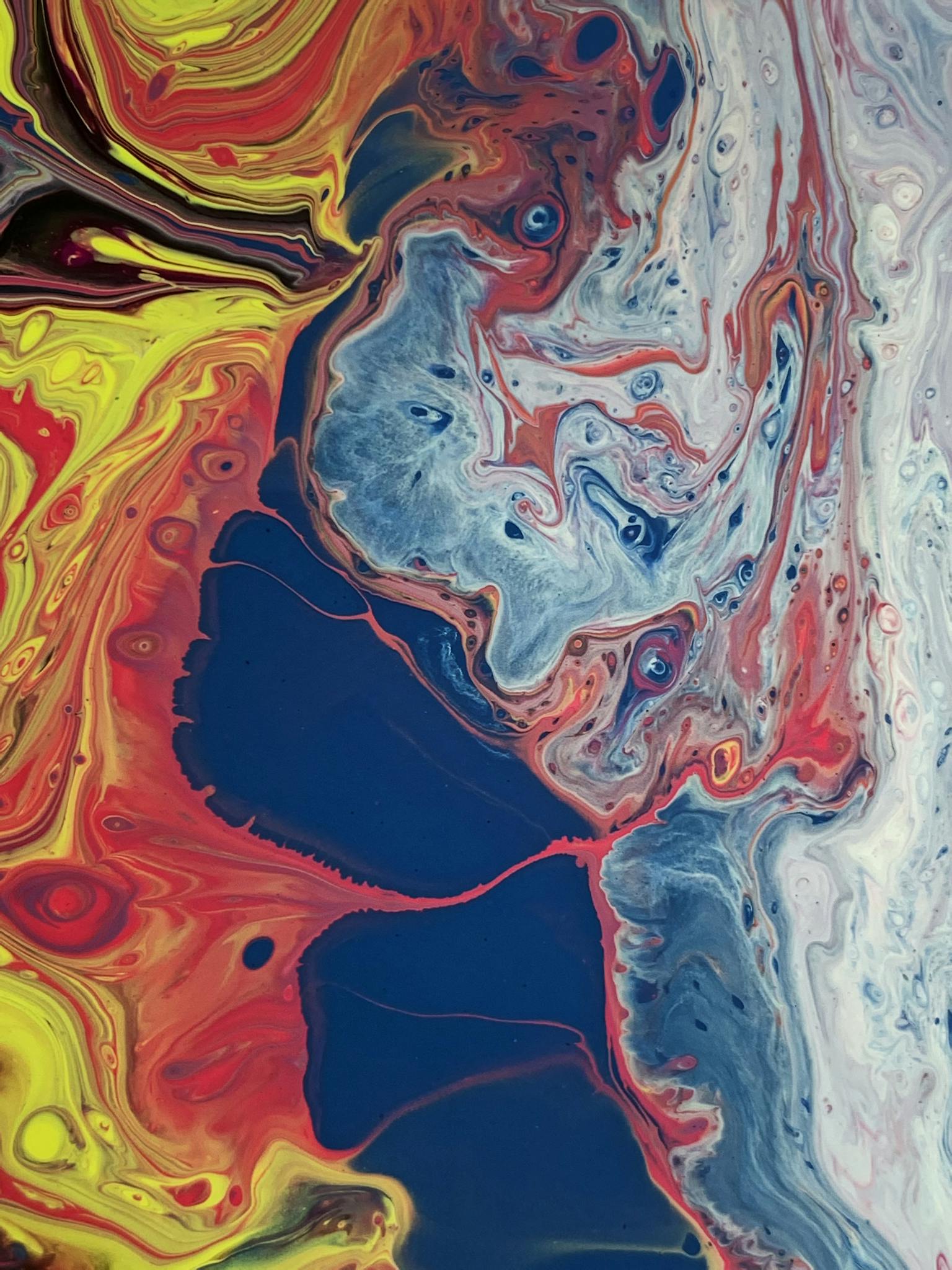 Abstract background of random spills of multicolored paint depicted to surface of canvas